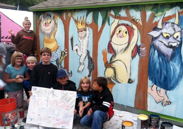 Artism kids mugging in front of their almost completed shed mural