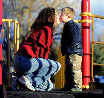 me and Rapha kissing at the playground