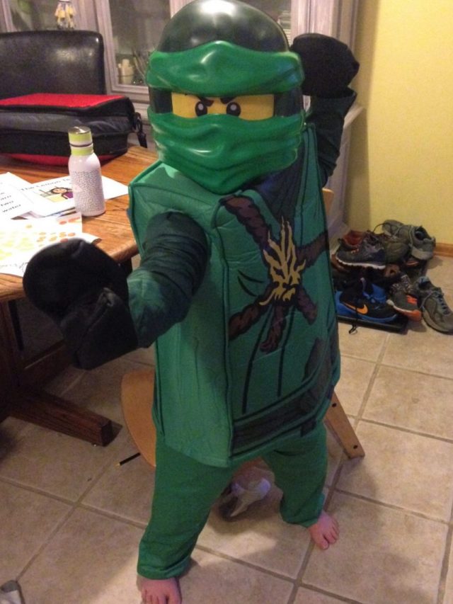 Raphael dressed for Halloween as green ninja Lloyd Garmadon from Ninjago.